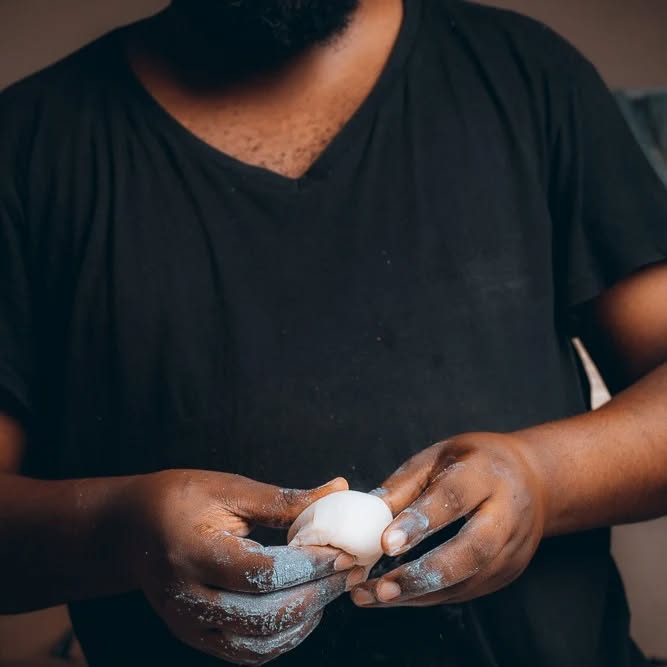 Chef Bakiel shaping dough for artisanal vegan bread or pastry