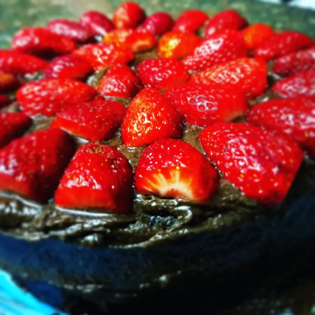 Decadent vegan chocolate cake with fresh strawberries - Bakiel Catering
